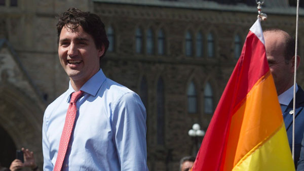 Prime Minister Justin Trudeau takes part in a Pride flag-raising ceremony on Parliament Hill on Wednesday. (Adrian Wyld/Canadian Press)